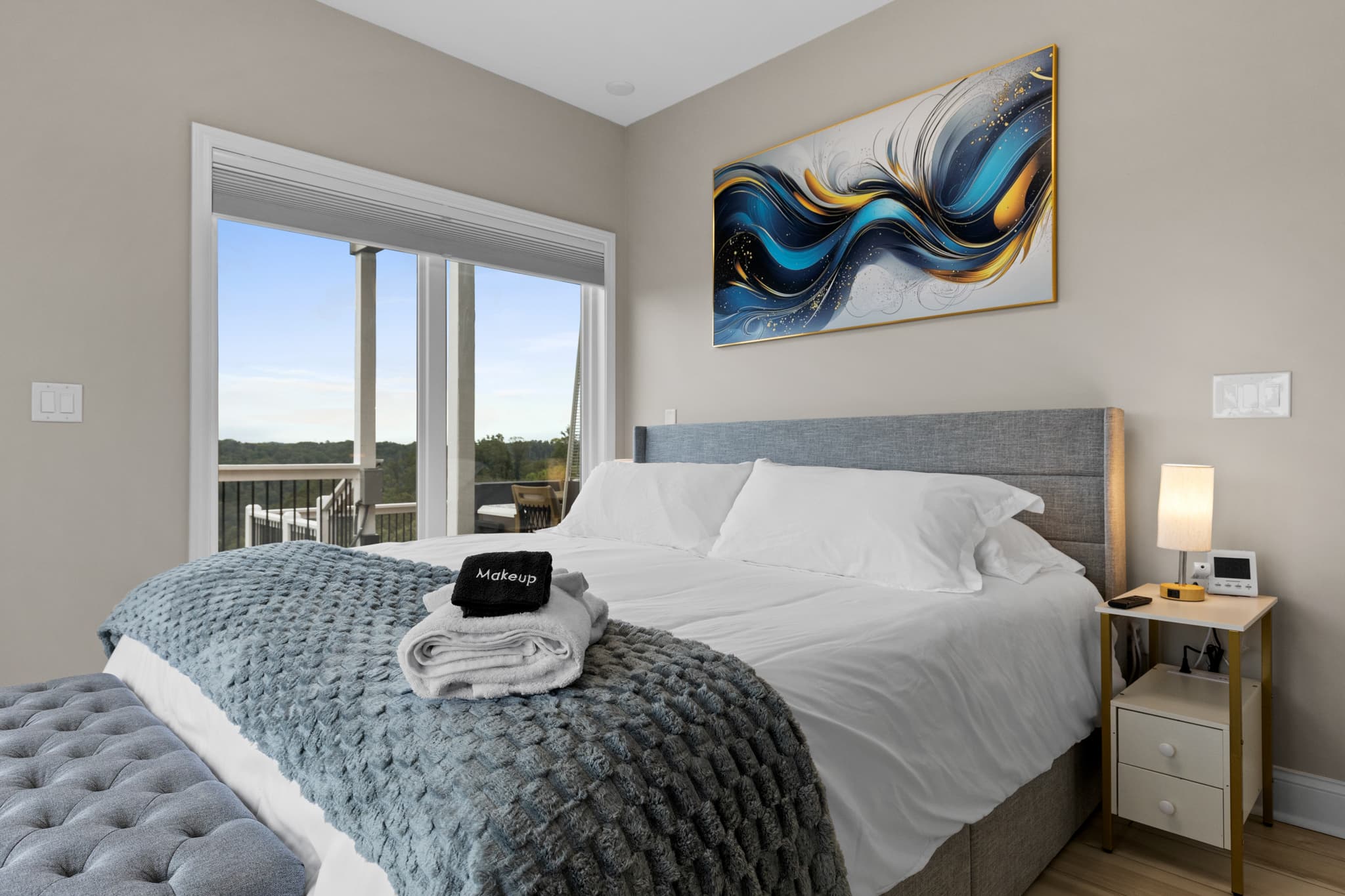 Second king bedroom with blue wall art