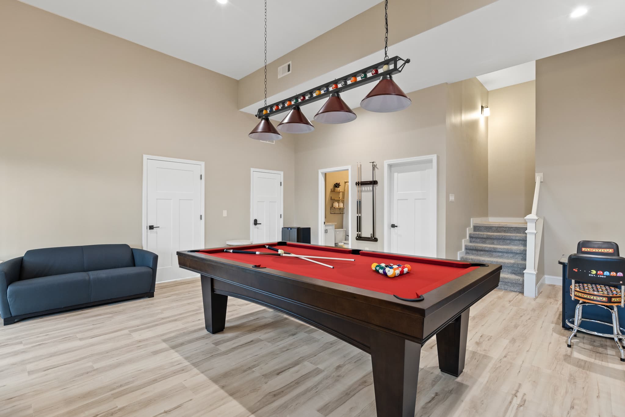 Game room with arcade and pool table