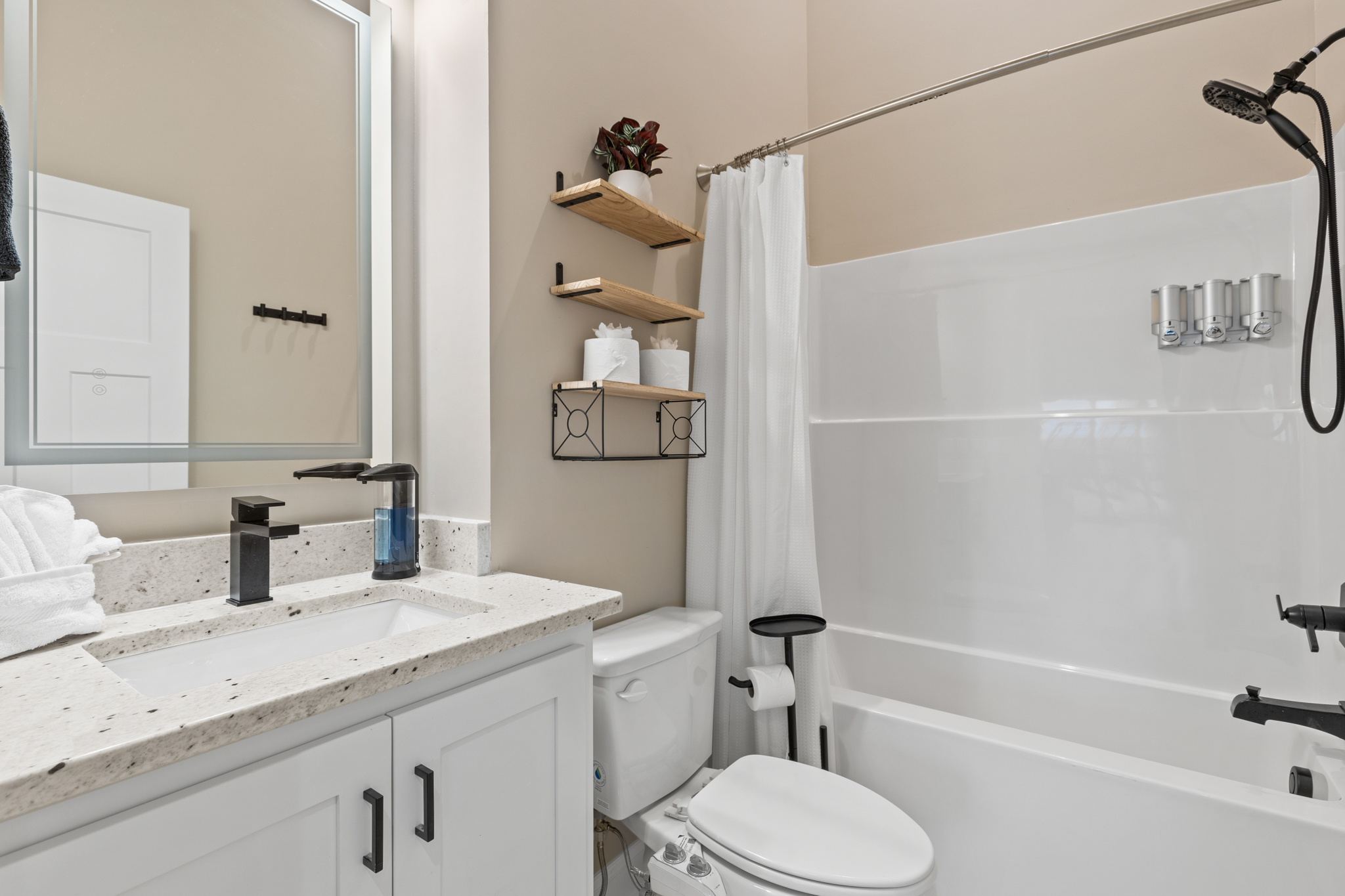 Third bathroom with tub/shower combo and vanity