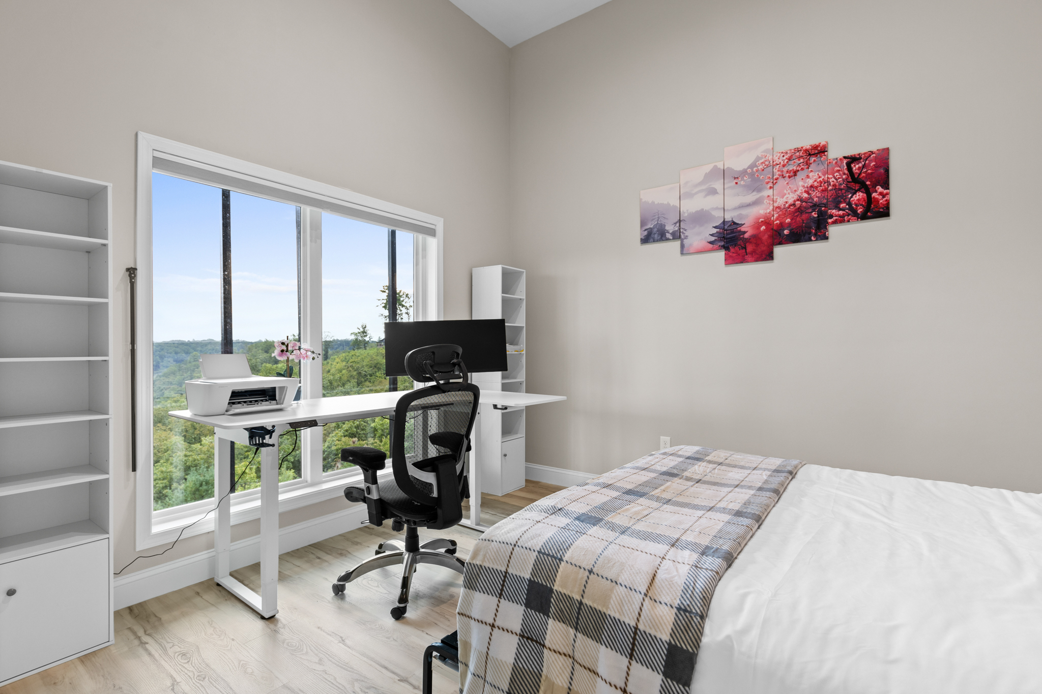 Office with murphy bed featuring plaid bedding