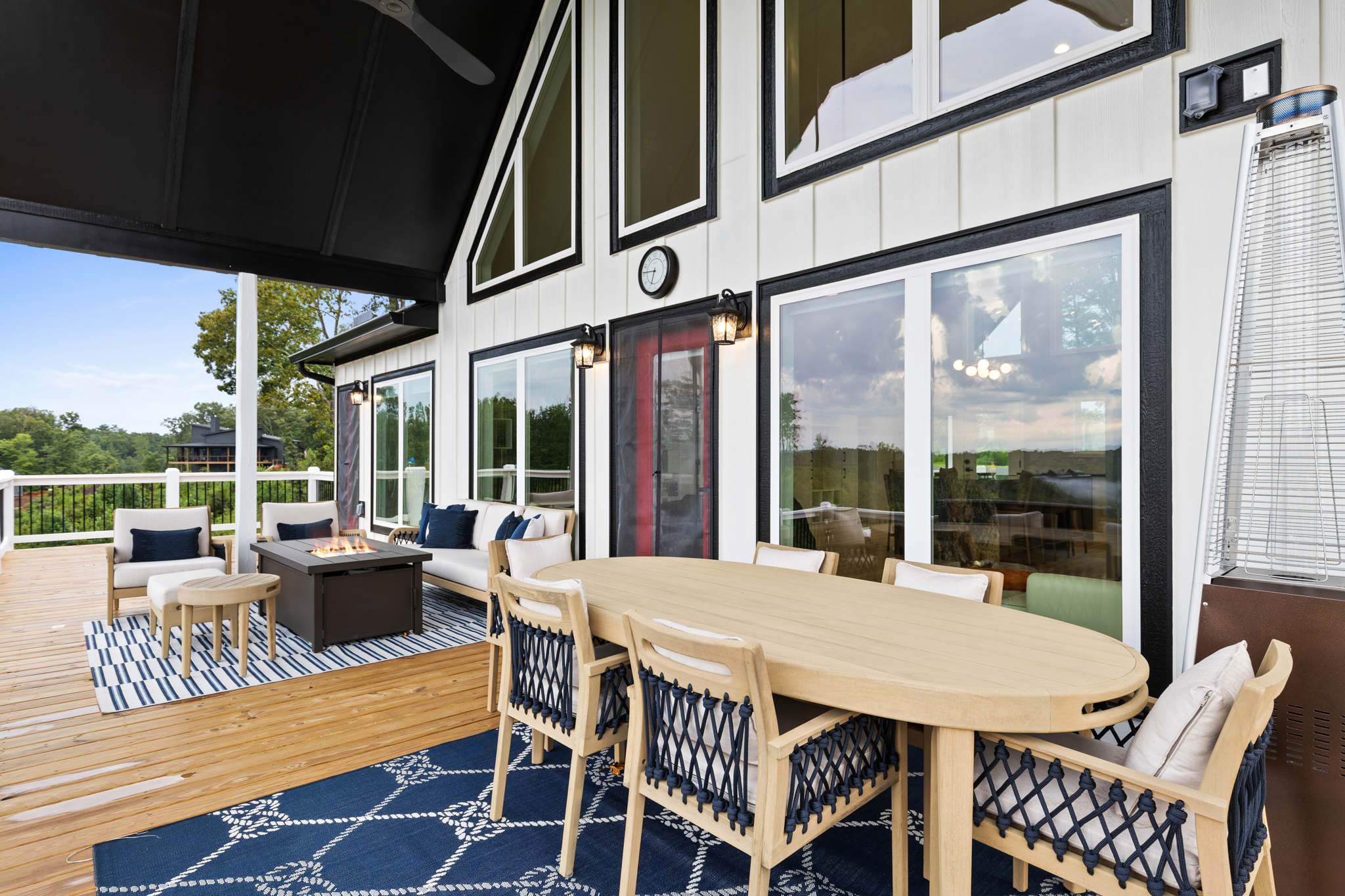 Deck dining area with outdoor table and lounge