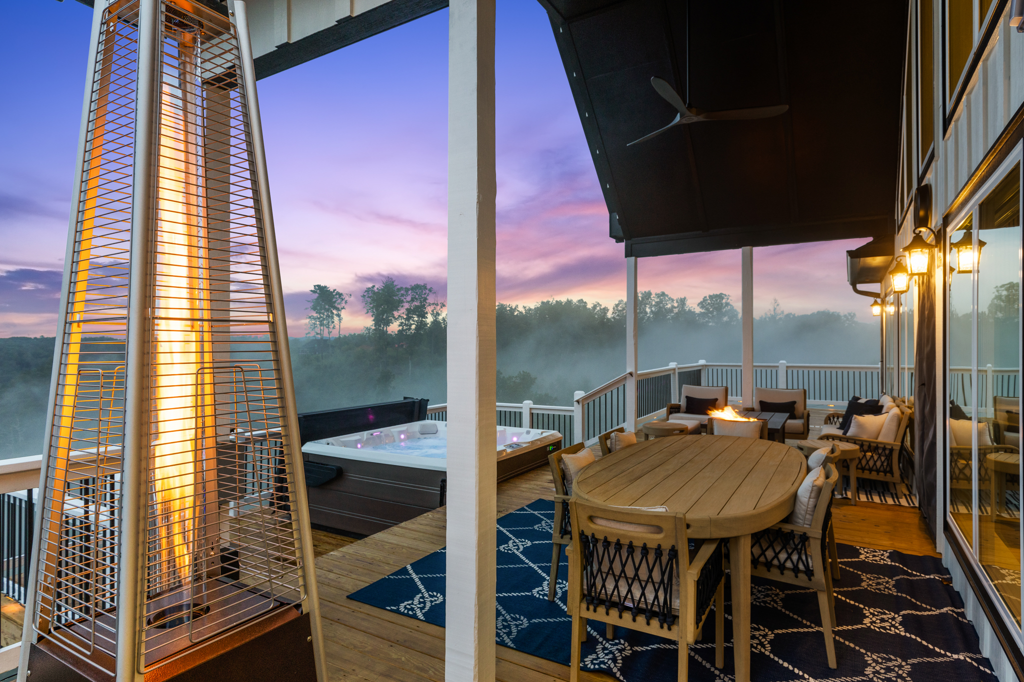 Wide deck view at evening with patio heater and fire