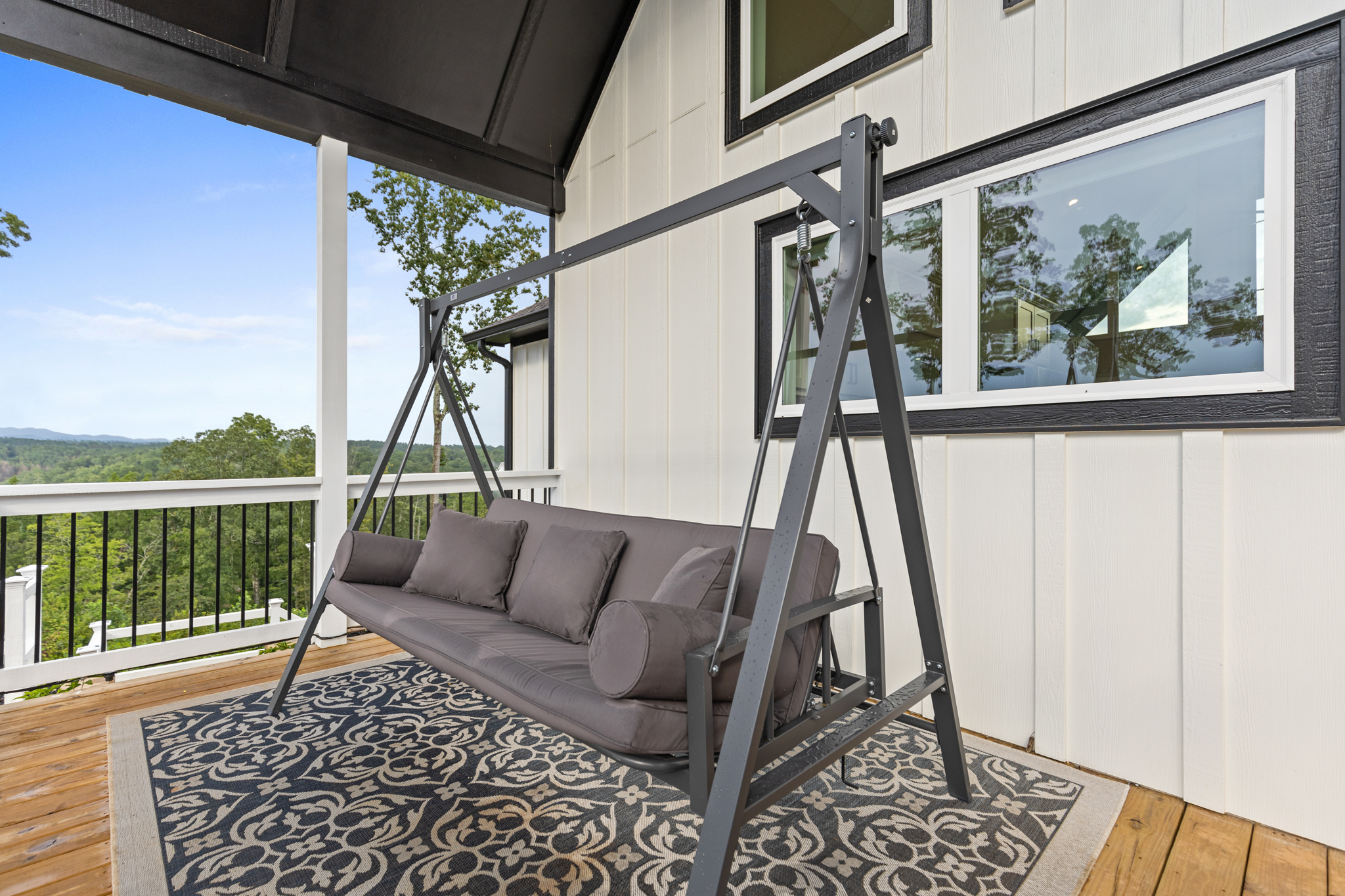 Covered porch swing on deck