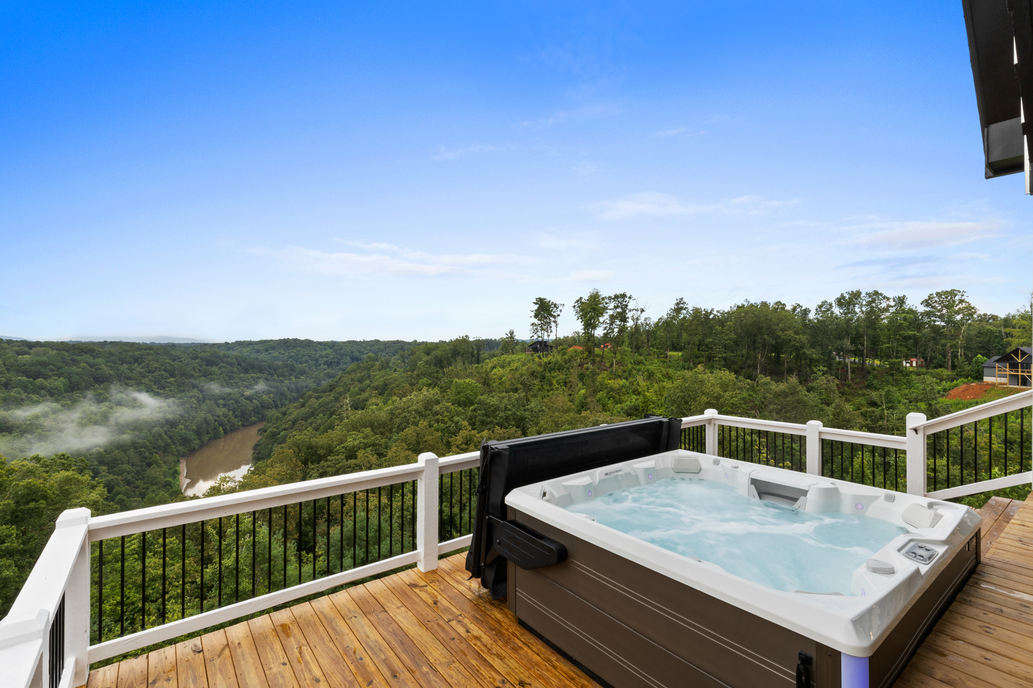 Hot tub angle showing river valley and mist