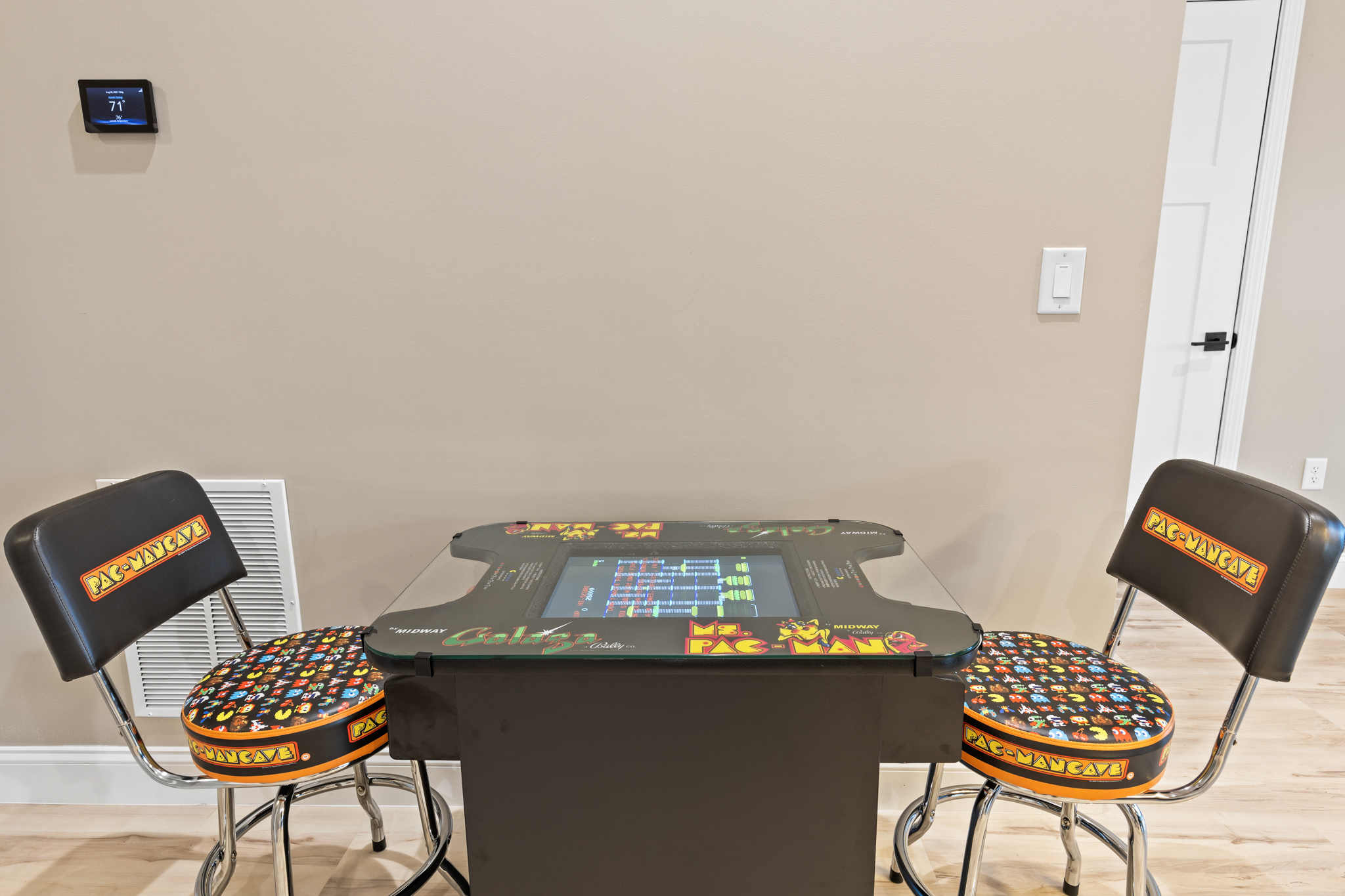 Pac-Man arcade cocktail table with retro stools