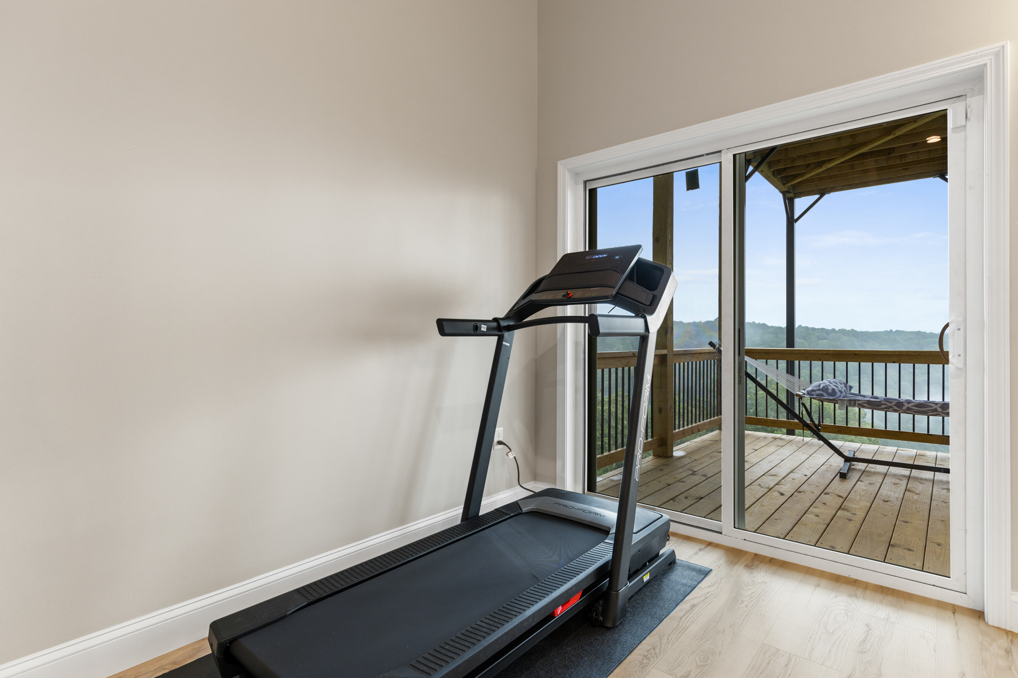 Treadmill with mountain and deck view