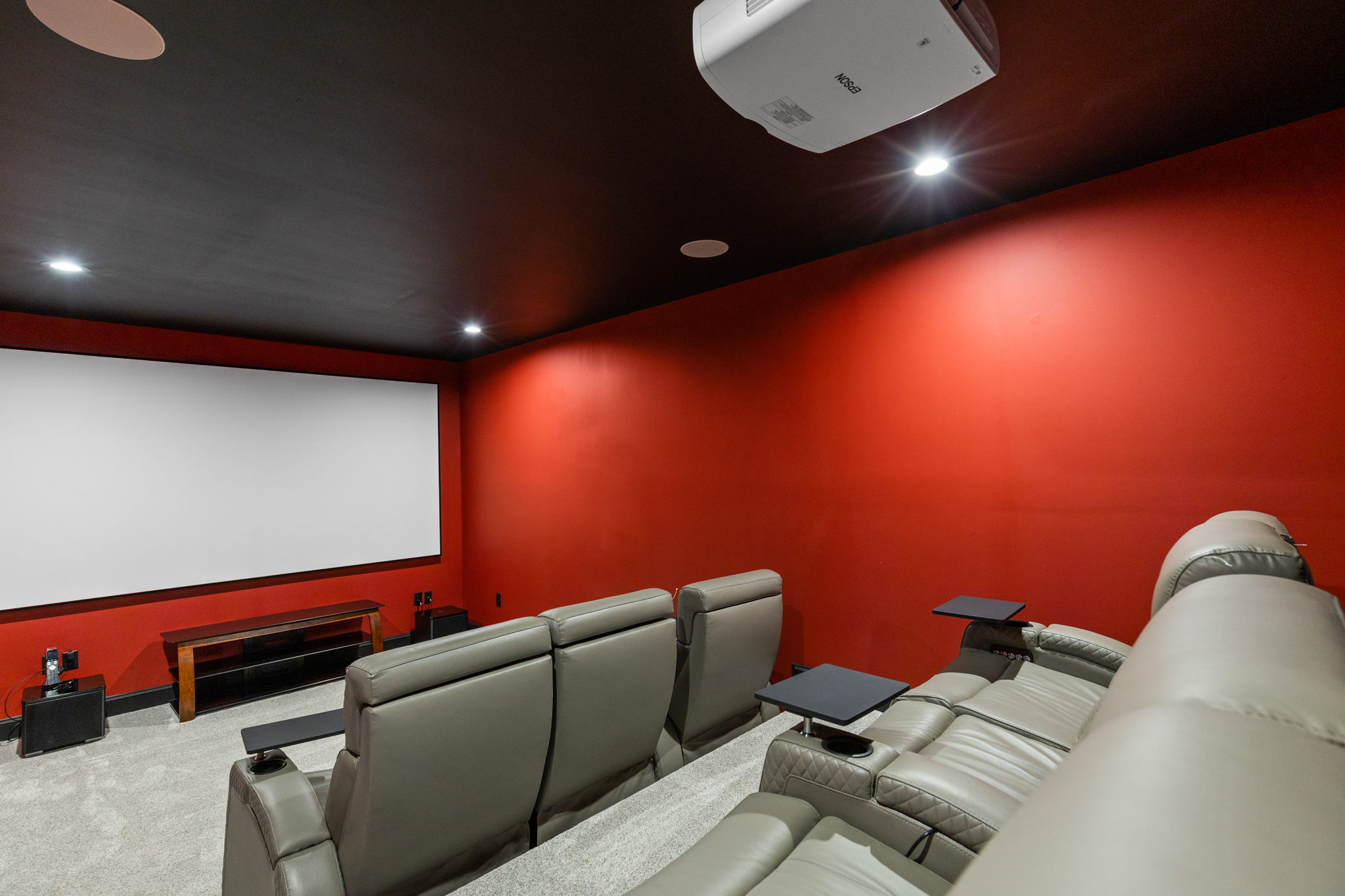Home theater showing projector screen and seating