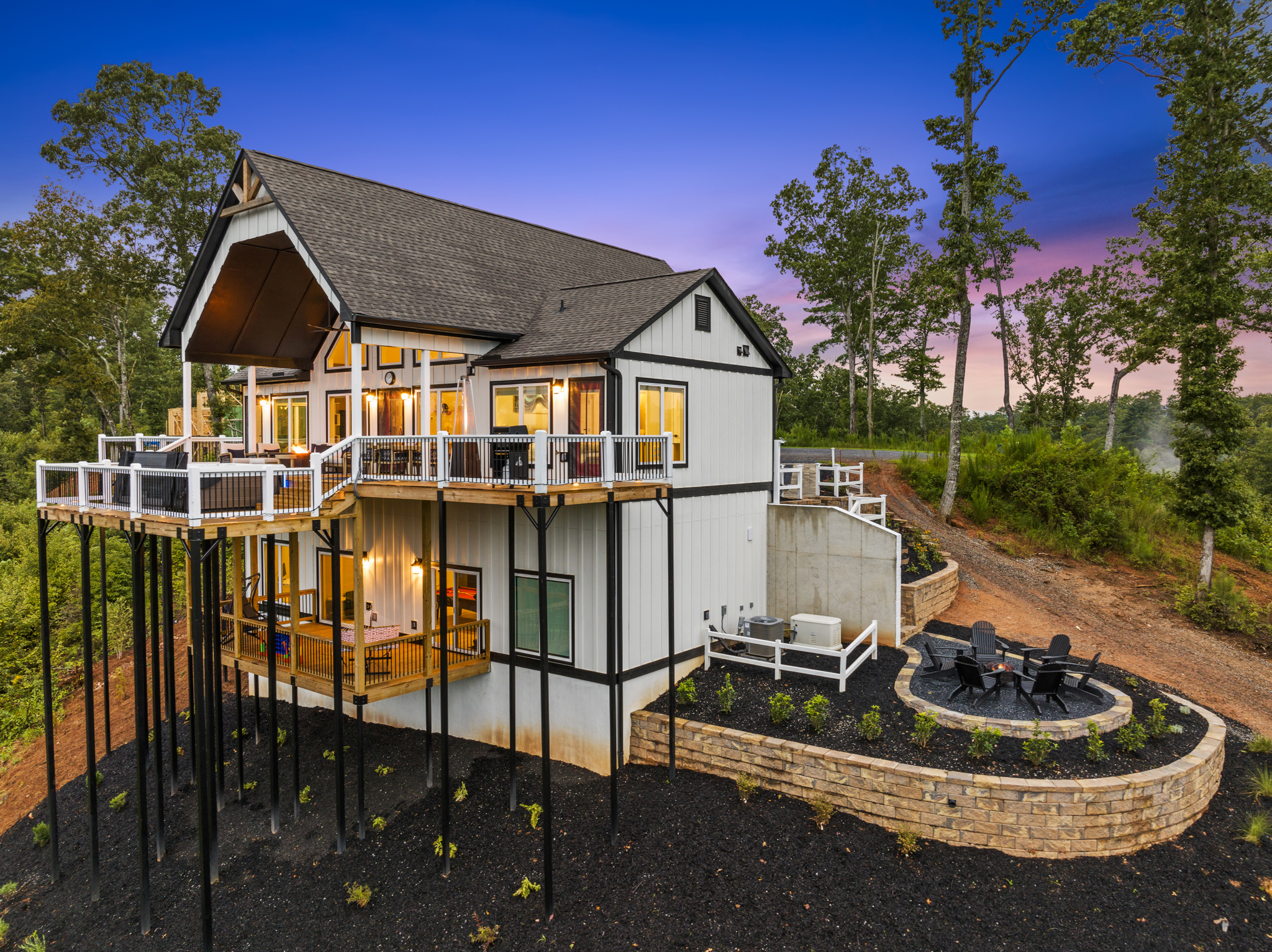 Side aerial showing fire pit area at twilight