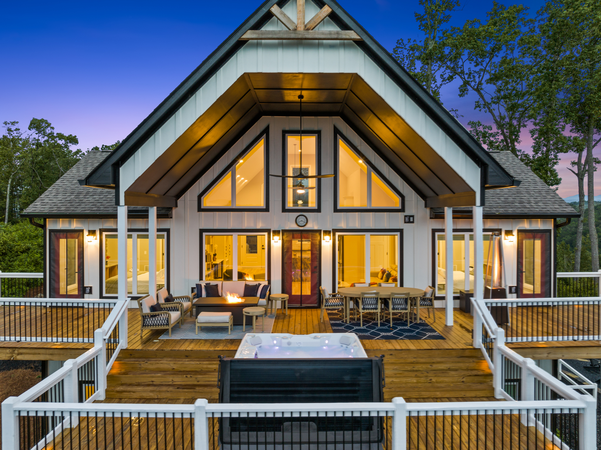 Perfect rear view showing full deck, hot tub, and fire pit