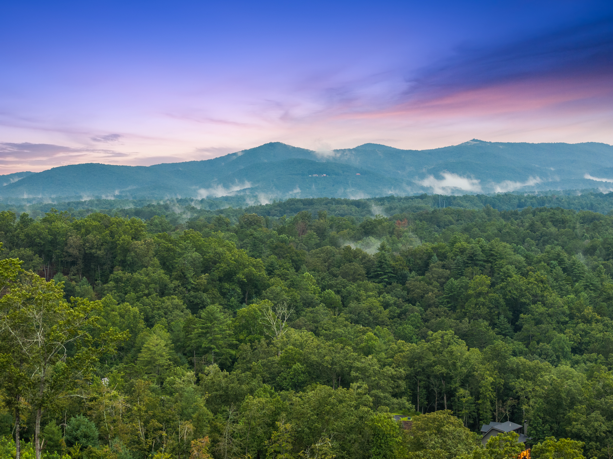 Pure mountain vista with sunset colors and mist