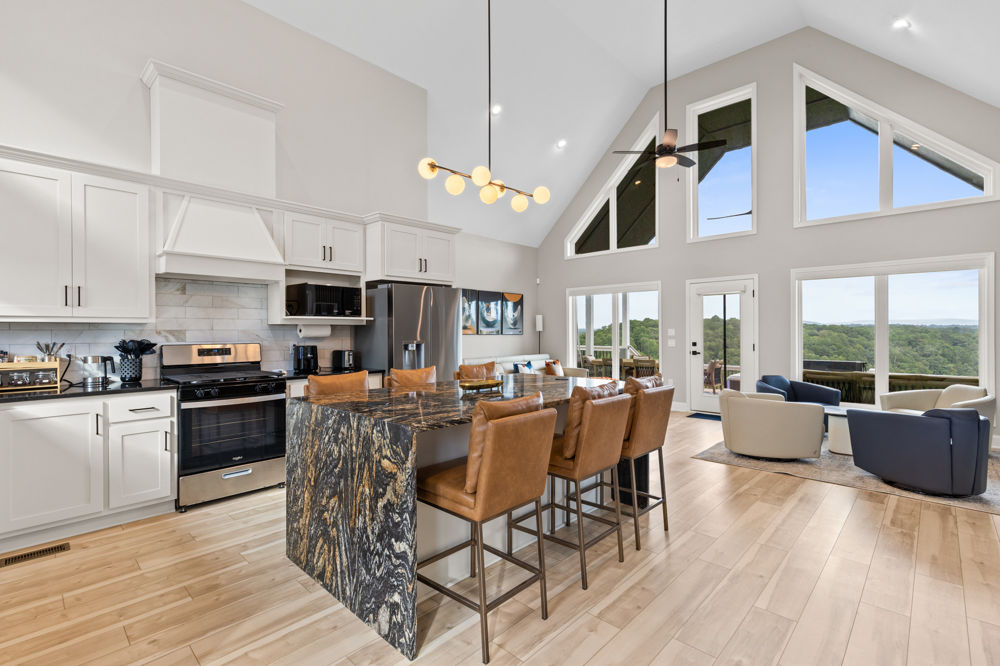 Open concept kitchen and living with floor-to-ceiling windows