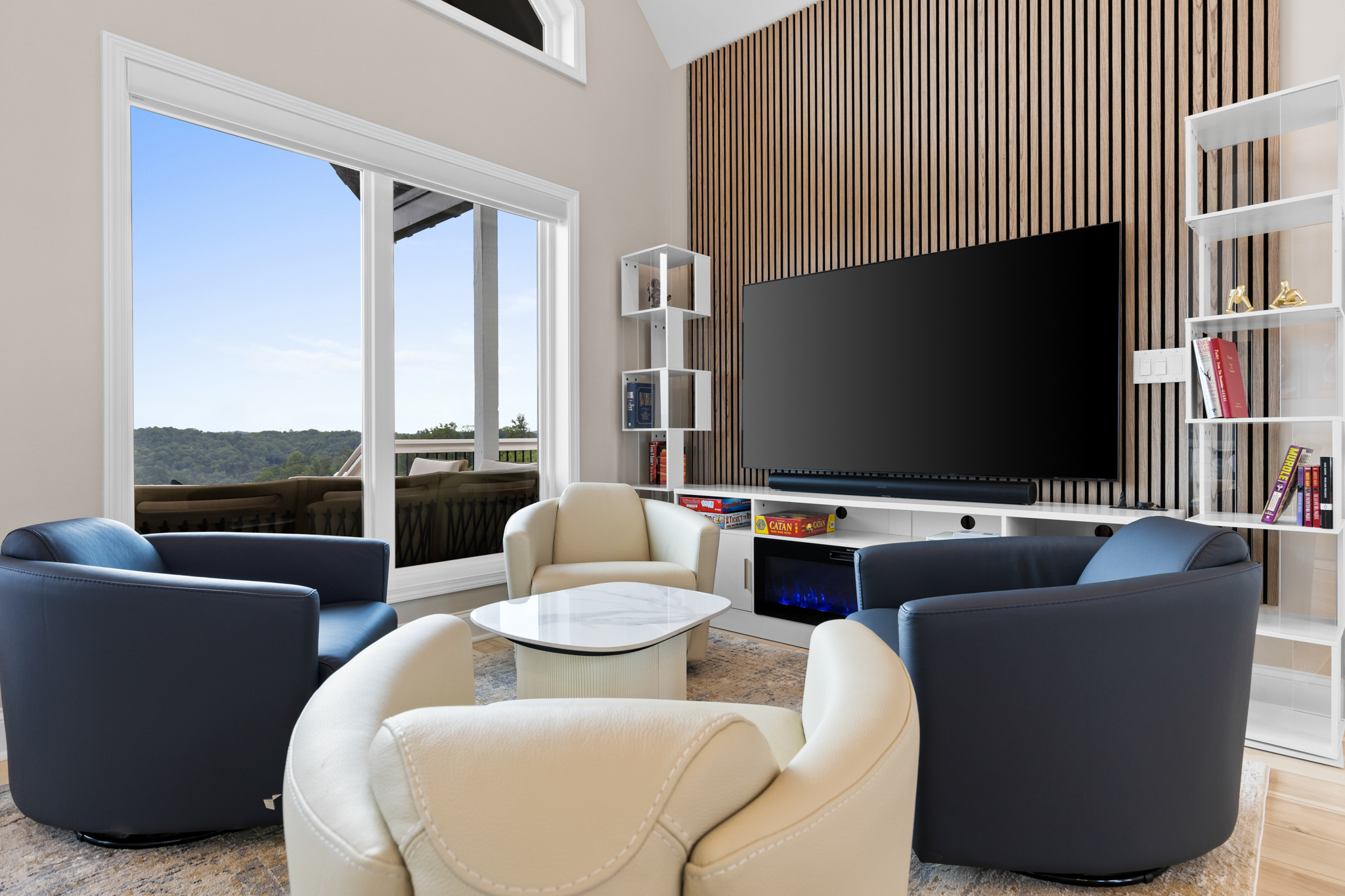 Living room with TV, slat accent wall, and electric fireplace